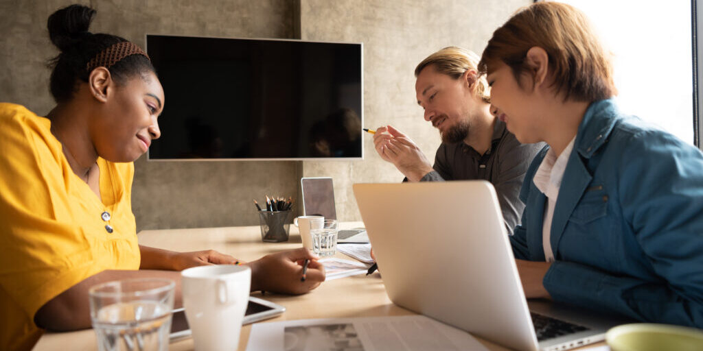 Multi-Ethnic Creative designers Meeting in conference room. Communication Teamwork Concept.
